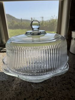 Glass cake stand with dome lid.