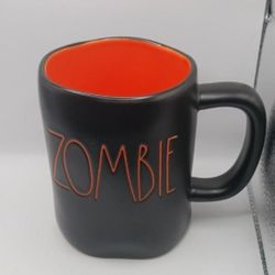 Rae Dunn Artisan Collection by Magenta "Zombie" Mug, black orange letters, orange inside