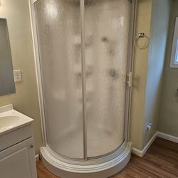 36" Corner Shower 2 piece Kit. Comes with base (high density shower base support attached) and curved sliding shower door