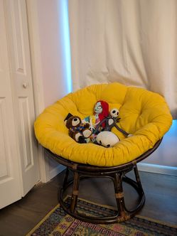 Dark brown  chair with comfy yellow cushion