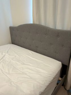 Grey queen sized bed