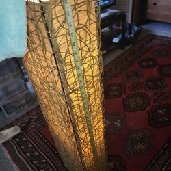 Modern/ contemporary tall floor lamp with wicker or rattan material