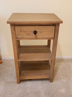 Sturdy wooden nightstand with one drawer and two shelves.