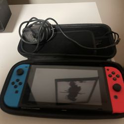 🎮 Nintendo Switch (Red/Blue Joy-Cons) – Great Condition
