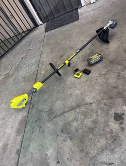 RYOBI 40V 15 in. Expand-It Cordless Battery Attachment Capable String Trimmer with 4.0 Ah Battery and Charger