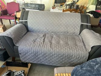 Grey sofa set with covers
