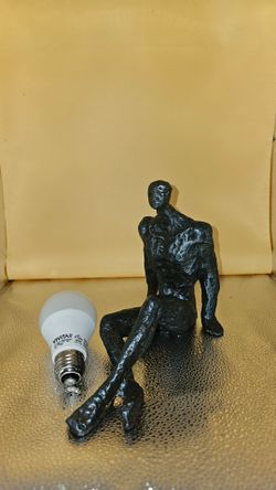 Metal book shelf statue