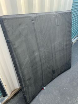 Folding soft top tonneau cover
