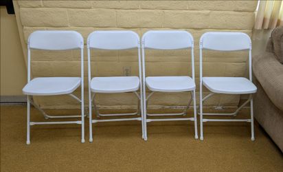 White folding party chairs.