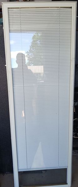 USED ODL WHITE ENCLOSED DOOR GLASS PANEL W/BUILT-IN BLINDS 66 1/2" H x 22 3/4" W SEE PICS FOR INFO