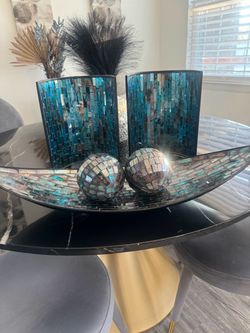 Two candle holders that hang on wall and matching tray