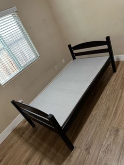 Twin bed with mattress and box spring