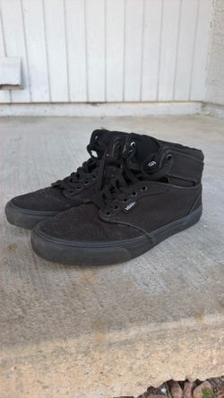 All black high top Vans