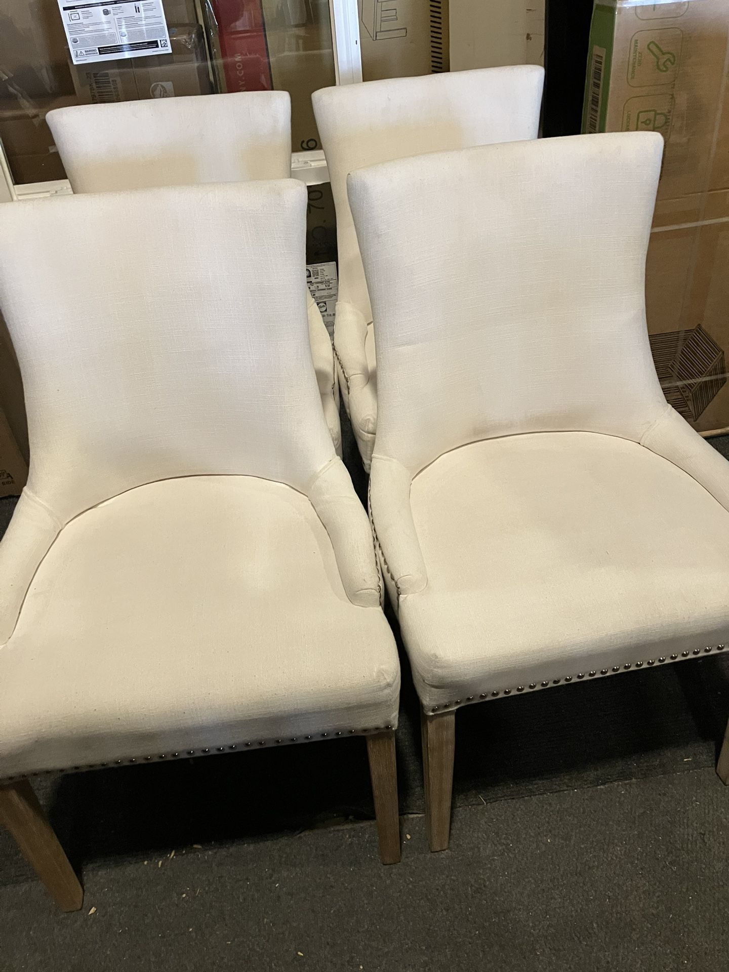 Set Of 4 New Pacific Direct Beige/Cream Wingback Chairs W/Minor Stains(See & Click On Pictures)(Been In Storage). Still In Very Good Condition