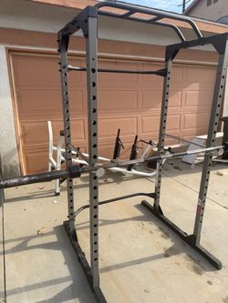 Very nice and strong squat rack with 7 ft Olympic bar. Perfect for squats, bench press, and pull ups. $300
