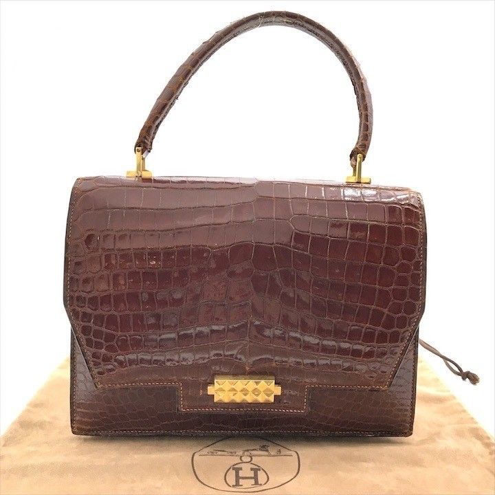 𝐇𝐄𝐑𝐌𝐄𝐒 porosus hand bag brown gold