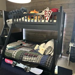 Pottery barn twin over full bunk bed. Comes with mattresses. Some knicks on outer corners and ladder. 