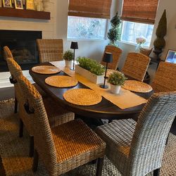 Oval dark wood dining table and chairs