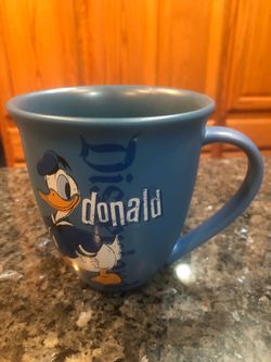 Disney Donald Duck Coffee Cup Mug.  The cup says “Disneyland Donald”.  Size  4 1/2 inches tall.  Nice weight.  Brand New Never Used.  Purchased at Dis