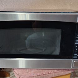 GE microwave Oven 2.0 Cubic Feet 1200 Watts 
Dimensions 13-3/4" high 24-1/8" wide x19-3/8" deep 