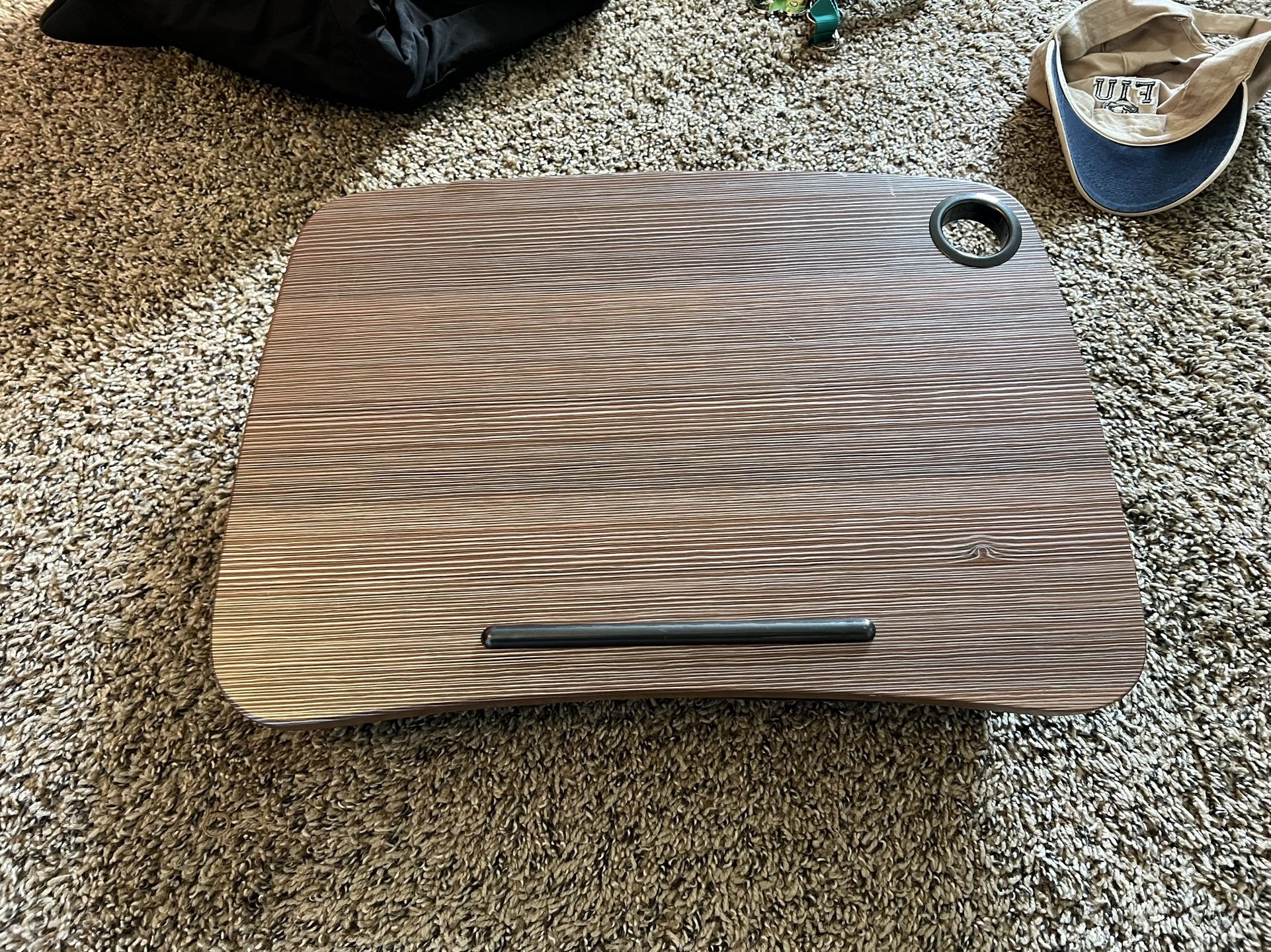 Laptop lap holder. Can hold a Mac book pro easily