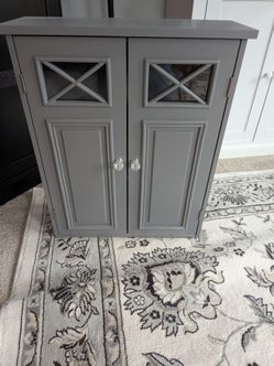 Gray Wood Cabinet with Glass Panel Doors