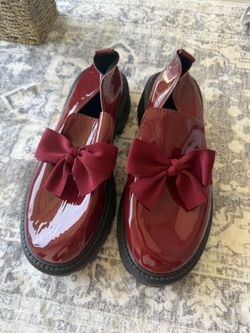 Glossy red loafers