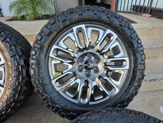 22" CHEVY rims w/ 35" Nitto Trail Grapplers