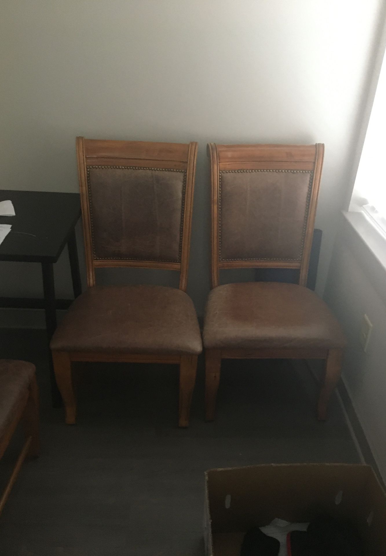 (4) Nice wooden, leather-cushioned dining chairs