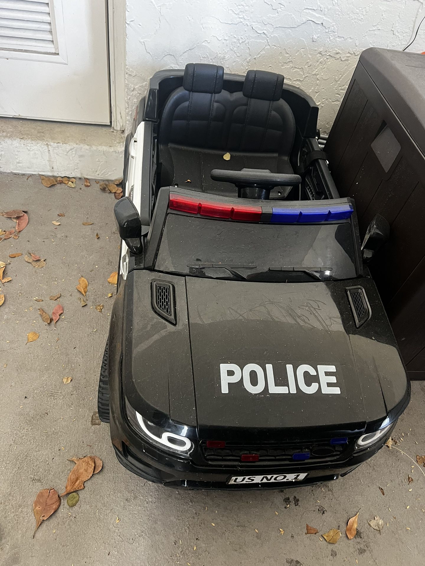 baby ride on police car battery powered with remote control, Bluetooth for music. And charger included.