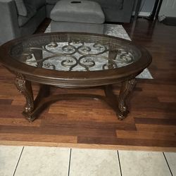 Coffee Table Dark Brown, Oval Glass On Top, Solid Wood.  Size 48” Long x 34” Wide x 20” High. 