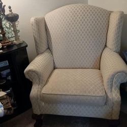 Two wingback chairs with claw feet
