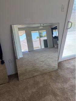 Large frameless mirror