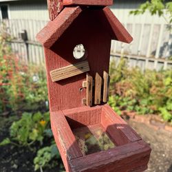 Tall wooden red Birdfeeder On Tall Post 