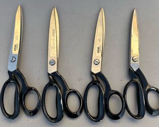 Wiss  and Mundial heavy-duty industrial shears, which are 10-inch bent-handle trimmers designed for professional and industrial cutting.