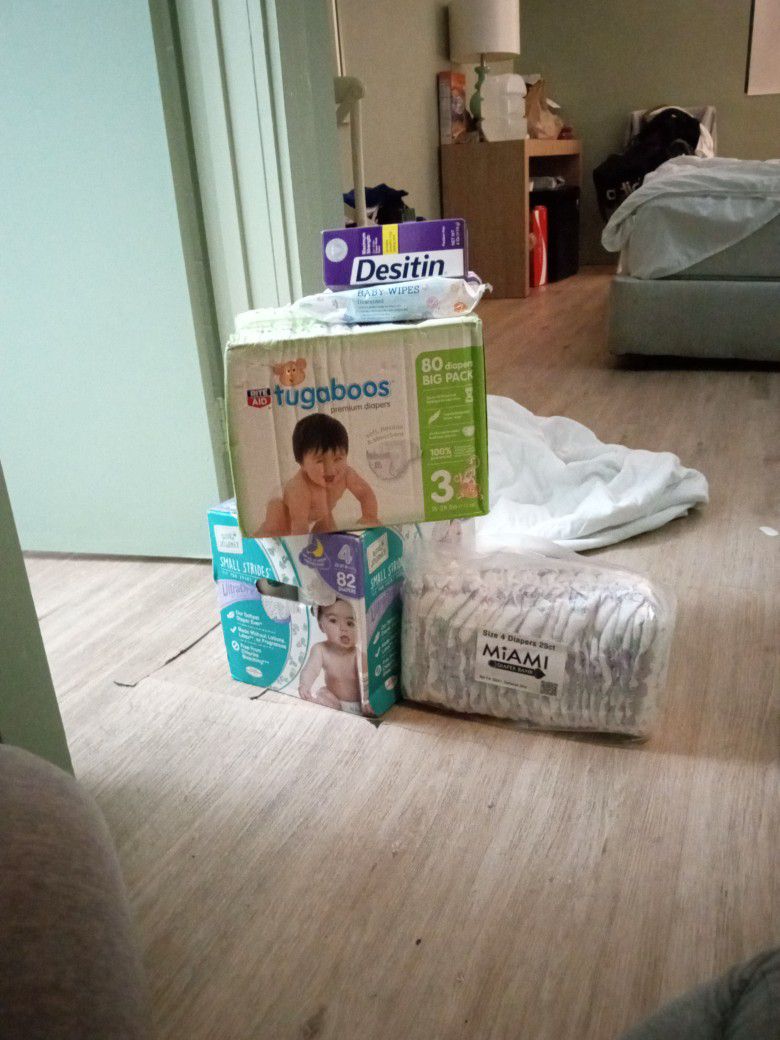 Size 3 N 4 Diaper Boxes And One Pack A Pack Of Wipes And Cream