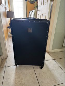 Black suitcase with gold detailing