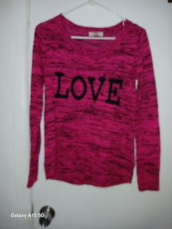 Size Medium PINK SWEATER With LOVE ON It ASKING 5$  OBO 