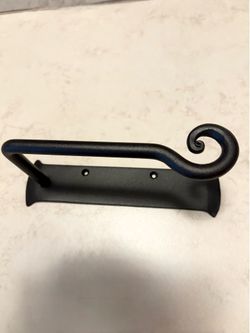 Wrought-iron towel holder. Toilet roll holder.