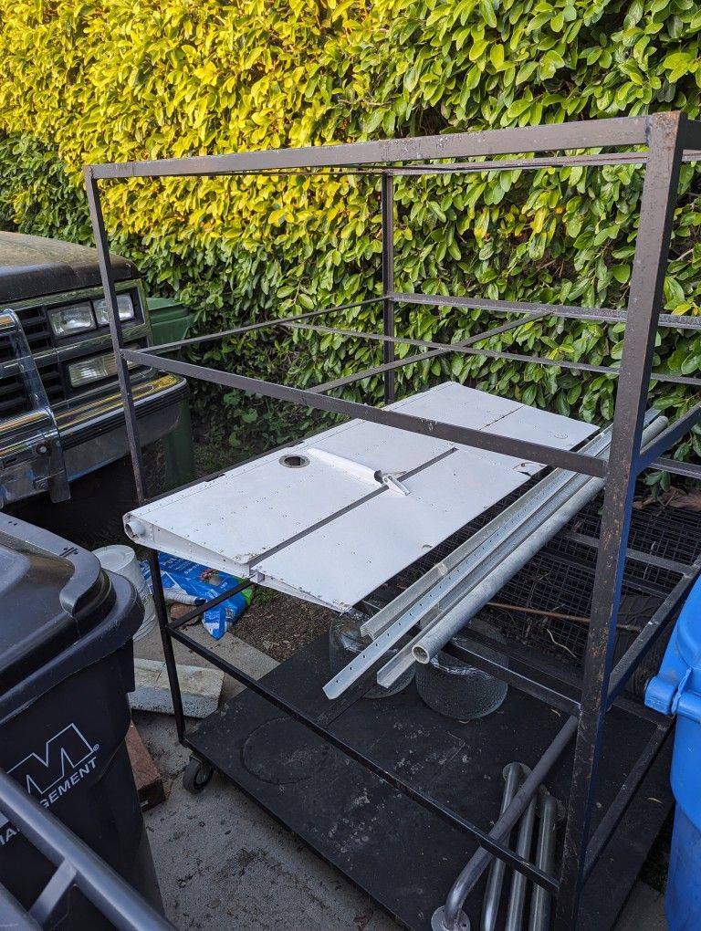 Rolling Cart Roughly 4 feet Wide And Deep. 5.5 Feet Tall