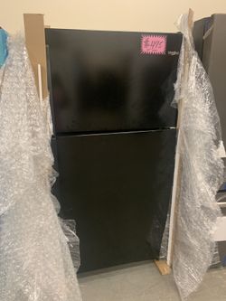 New Whirlpool 33in. Top freezer refrigerator with 1 year manufacturer warranty