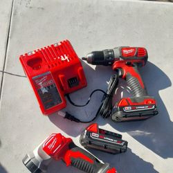 MILWAUKEE DRILL AND FLASH LIGHT 18V LITHIUM WITH BATTERYS AND CHARGER 