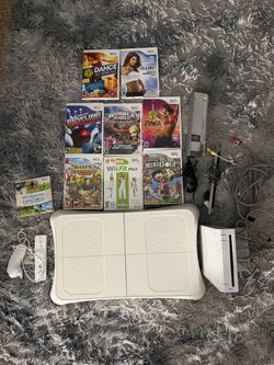 Nintendo Wii with fit board and 9 games (tested)