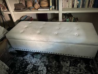 Cream colored storage ottoman