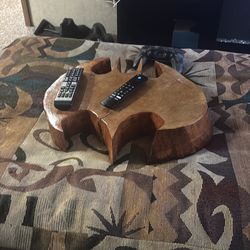 Tree stump hand carved Batman symbol