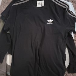 Bulk Of Mens T Shirts And A Gray Zippered Sweater