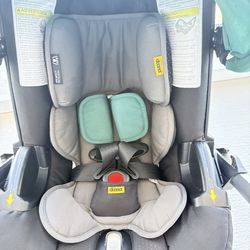 Doona Car Seat Stroller + Car Seat Base + Travel Bag (Green) - Like New Condition