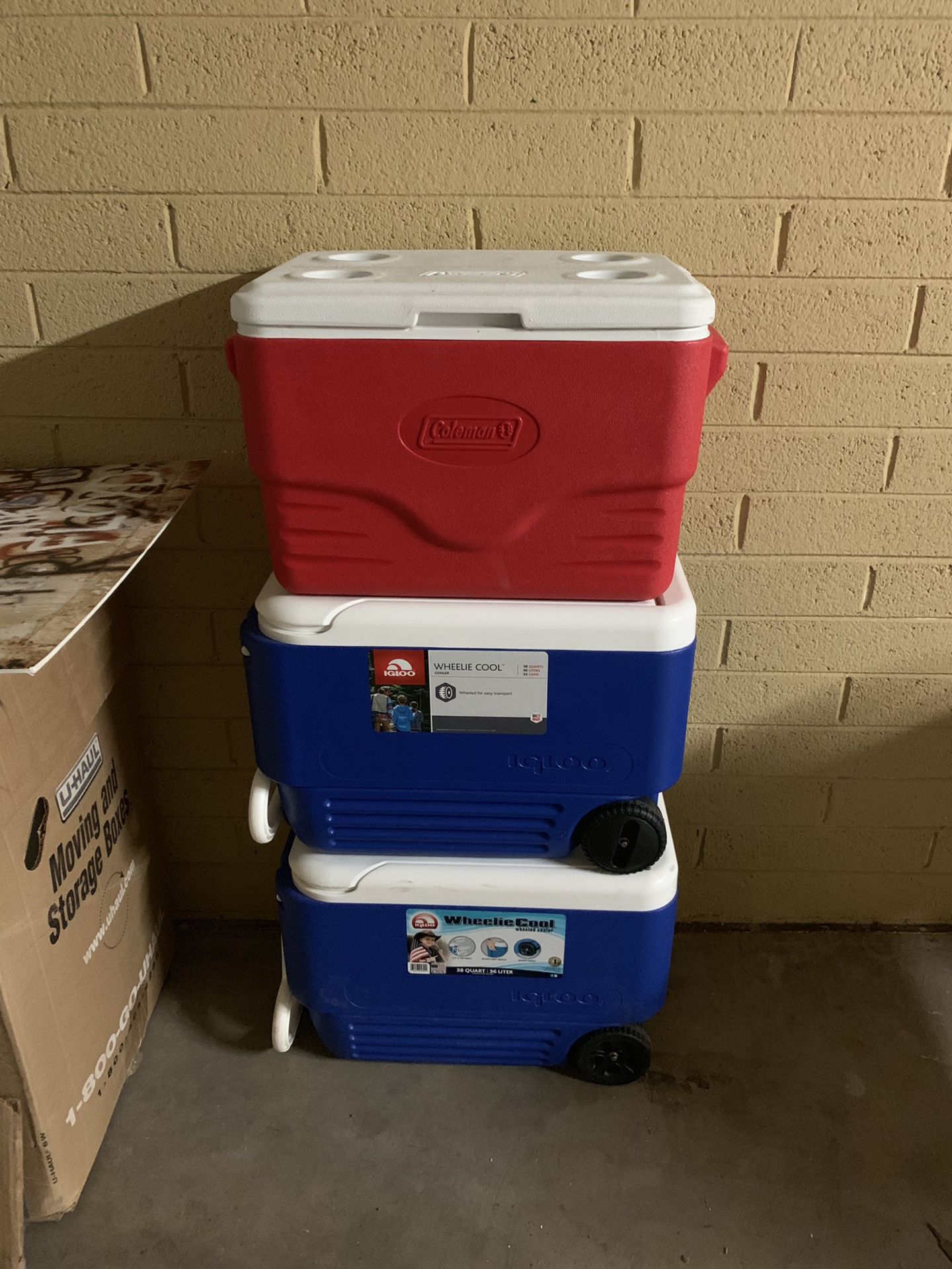 2 igloo rolling coolers and 1 coleman