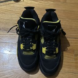 Jordan 4s black and yellow thunder