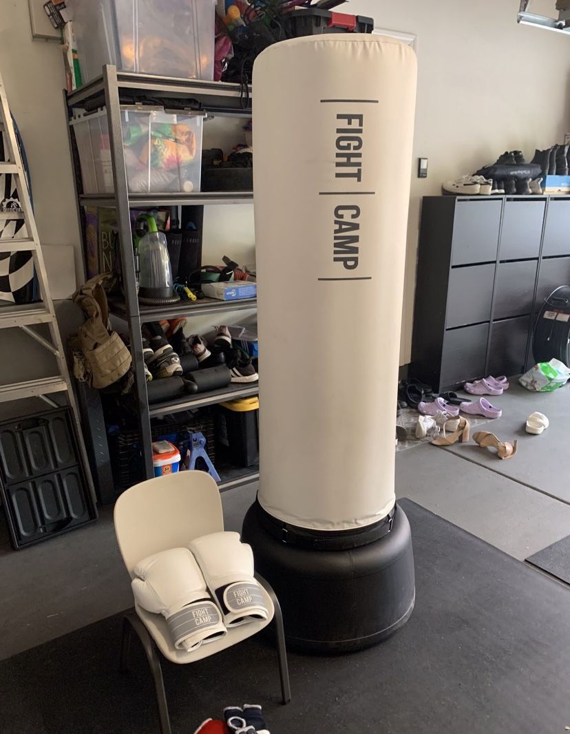 LIKE NEW: Fight Camp punching bag, base, mat, tracker, hand wraps & 4 pair of boxing gloves 